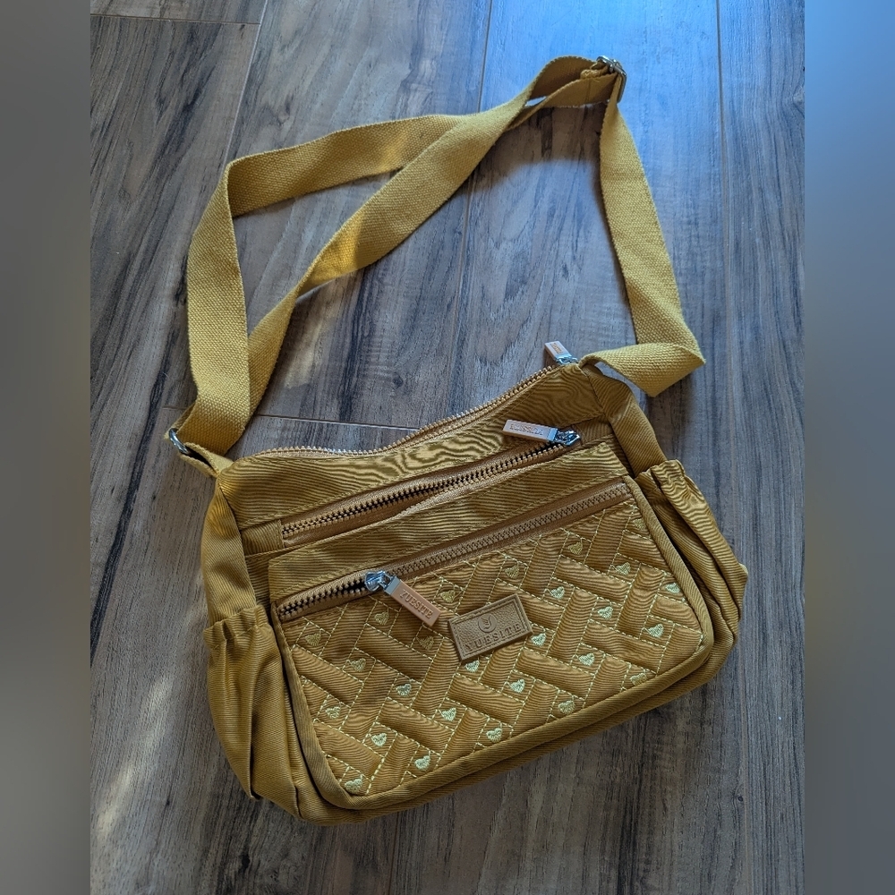 Yuesite Marigold Yellow crossbody bag with lots of storage.